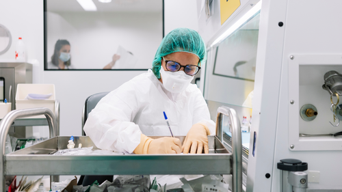Female pharmacist writing prescription